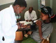 A health worker assesses a patient at Dukiem Health Center southeast of Addis Ababa